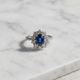 Oval Royal Blue Sapphire and Diamond Floral Halo Engagement Ring