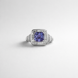Cushion-Cut Tanzanite and Baguette Diamond Halo Ring in White Gold